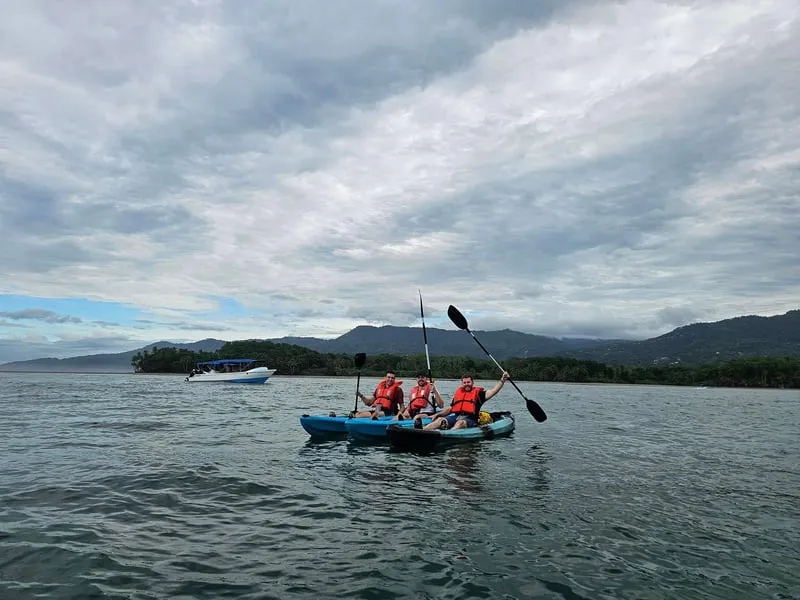 Ocean kayakers paddling the Whale's Tail formation in Marino Ballena National Park on a snorkeling uvita Costa Rica eco tour